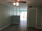 Living Room - new flooring and open floorplan leads into breakfast area - 1057 Tallow Tree Ln