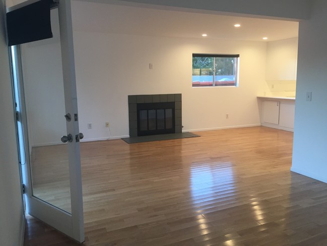 Living room, wood burning fireplace - 504 Altair Pl