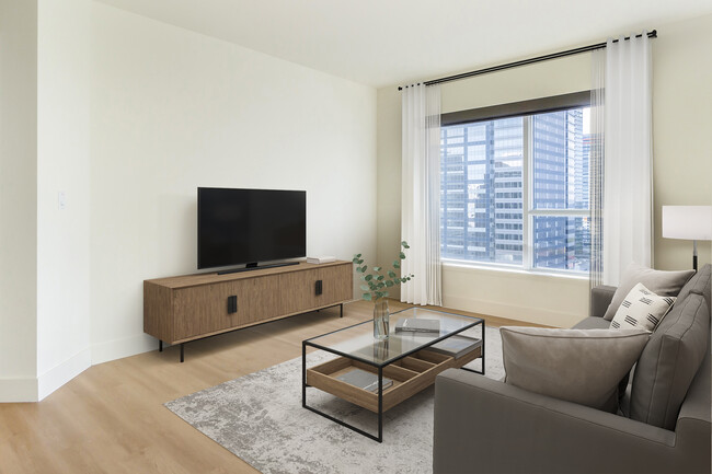 Renovated Package I living room with hard surface flooring - Avalon Towers Bellevue