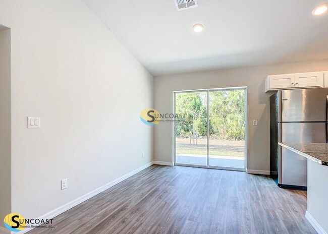 Building Photo - APP FEE WAIVED:  4-Bedroom Home with Slidi...