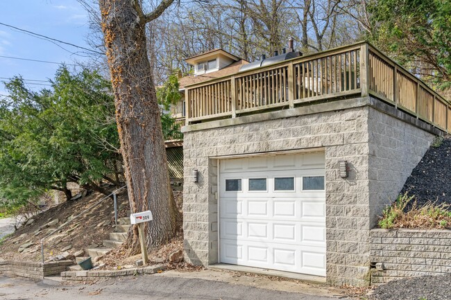 The garage connects to the house to shelter you and your car from rain - 309 Highland Ter