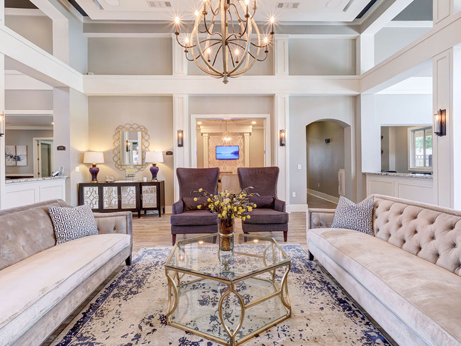 Stunning community lounge with coffee bar, chandelier and plush seating - Aspire Fossil Creek