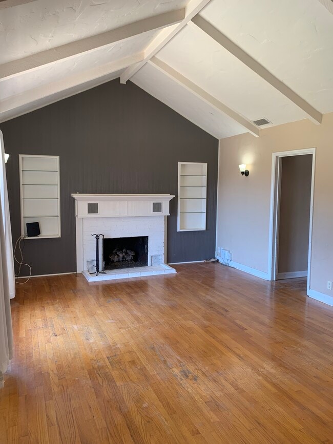 Living room with fireplace and built in shelves - 1702 Golden Ave