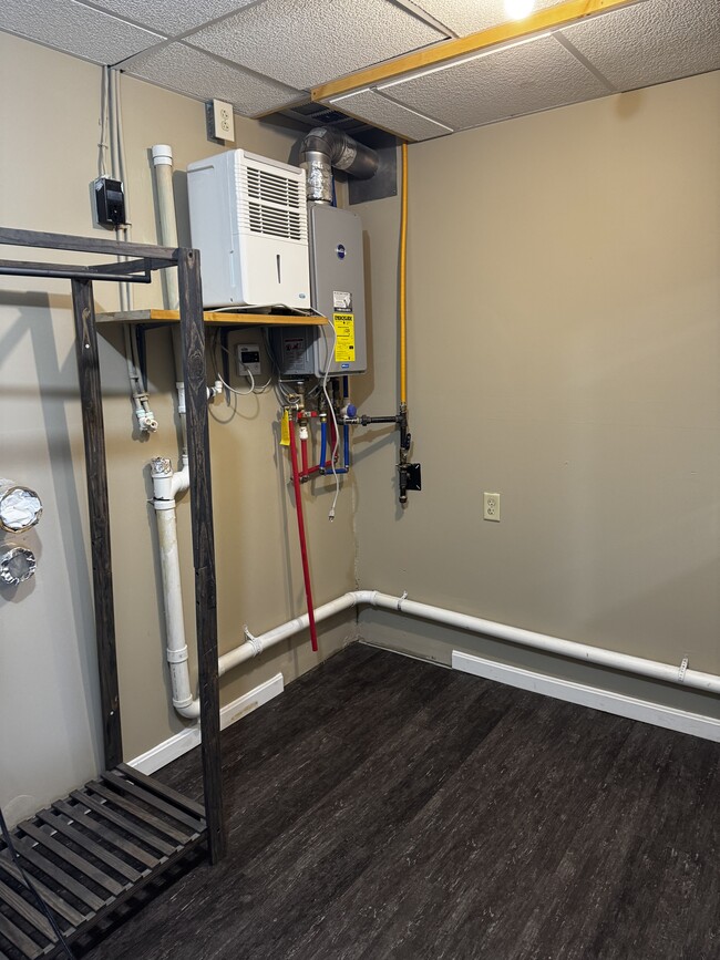 Laundry hook up. Tankless water heater. - 704 Main St