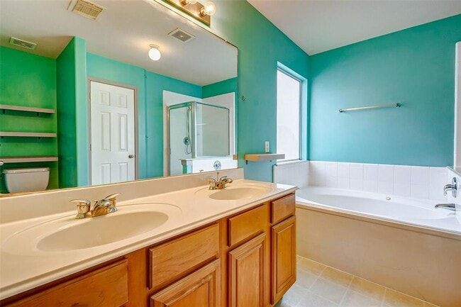 Building Photo - This one-story, three-bedroom, two bath ho...