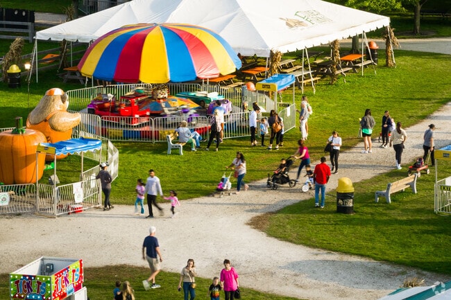 Happy Times Pumpkin Fest features fun carnival rides for family entertainment.