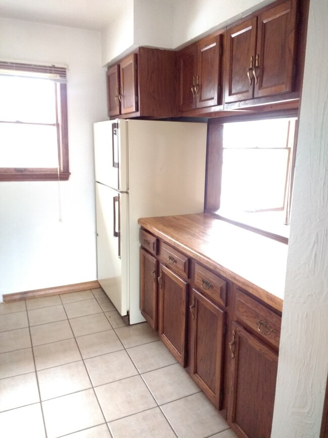 Kitchen with pass-through window to Dining Room - Whetstone Creek Apartments