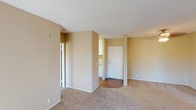 Located at 800 E Lexington in El Cajon, unit #315 is a single-floor residence designed with a practical and comfortable layout. The living area is finished with plush wall-to-wall carpeting and warm beige walls, creating a neutral and inviting atmosphere. A ceiling fan provides both light and airflow to the main living space. The layout flows naturally from the living area toward the kitchen and entry, with a transition to wood-look flooring in the kitchen and entryway zones.

The kitchen is equipped with white cabinetry offering ample storage, light-toned laminate countertops, and a double-basin stainless steel sink. The clean, bright design makes for an efficient and functional cooking space.

The bedrooms continue the carpeted flooring and neutral color palette, each featuring windows with vertical blinds that allow natural light to filter in while offering views of the surrounding greenery. At least one bedroom includes a sliding closet for organized storage.

The bathroom features a full-sized tub and shower combination with clean white surrounds and chrome fixtures, presenting a simple and well-maintained space. Textured ceilings are present throughout the unit, adding a consistent architectural detail. Overall, the unit offers a straightforward, move-in-ready environment well-suited for comfortable everyday living.