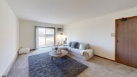 This well-appointed 850 square foot apartment in Madison, WI offers a comfortable and efficient living space. The open-concept living area is the heart of the home, featuring plush carpeting, a ceiling fan for air circulation, and large sliding glass doors that flood the space with natural light. The living room seamlessly connects to a dining area, perfect for entertaining or casual meals.

The kitchen is modern and functional, boasting wooden cabinetry, granite countertops, and black appliances including a side-by-side refrigerator. Ample counter space and storage make meal preparation a breeze. The bathroom has been updated with a granite vanity top, large mirror, and a shower/tub combination with a patterned curtain for added style.

The primary bedroom, measuring 150 square feet, is spacious and bright, with a large window and built-in closet. The second bedroom also features a window and closet space. Both bedrooms are carpeted for comfort. The apartment includes two additional closets for extra storage.

Throughout the space, neutral walls and trim create a blank canvas for personal decor. The apartment's layout is efficient, making the most of its 850 square feet. Located at 7726 Radcliffe Dr in Madison, this single-story apartment offers a blend of comfort and convenience in a desirable neighborhood.