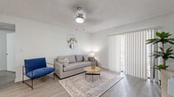 Located at 2550 Stag Run Blvd in Clearwater, Florida, this single-floor residence at Ava offers a clean, contemporary design throughout. Light wood-look flooring flows seamlessly across all living areas, contributing to a bright and cohesive aesthetic.

The welcoming entryway opens to an airy living room, where a ceiling fan with light, neutral-toned walls, and a sliding glass door with vertical blinds allow natural light to fill the space. The kitchen is thoughtfully designed with white cabinetry, a marble-style countertop, stainless steel appliances — including a microwave, range, and refrigerator — and a peninsula breakfast bar with seating for two.

Adjacent to the kitchen, a dedicated dining area provides an intimate setting, framed by a window with horizontal blinds and accented by soft wall décor. The bedroom is generously proportioned, featuring a large window that brings in ample natural light and direct access to a spacious walk-in closet outfitted with wire shelving on multiple walls.

The bathroom is finished in a clean, modern style with a white vanity, large mirror, and in-unit laundry access. Textured ceilings are present throughout, adding architectural character. The overall ambiance is light, calm, and move-in ready, reflecting a well-maintained and thoughtfully updated interior.