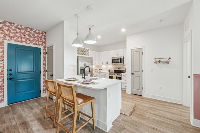 Kitchen with Quartz Countertop and Stainless Steel Appliances. - Forayna Watercolor Place