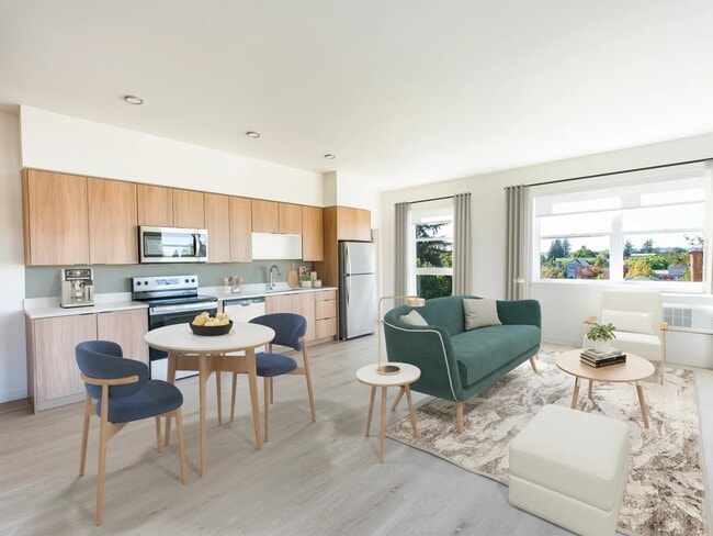 Experience the heart of home at Modera Woodstock. Our stylish kitchen and living areas feature gourmet quartz countertops, custom 36-inch cabinetry, and the option to choose from two unique finish packages. - Modera Woodstock