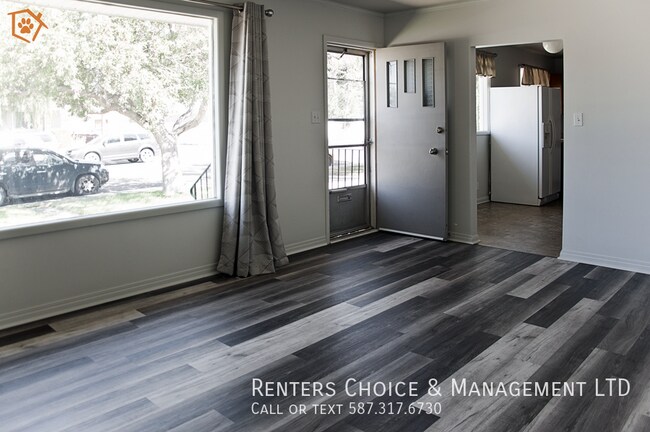 Building Photo - Dog Friendly Main Floor Suite with Fenced Yard & Driveway Parking