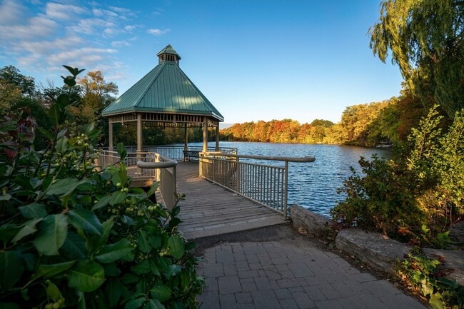 Gazebo by the water at Centennial Park with fall colors.