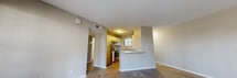 This contemporary apartment in Daytona Beach offers 910 square feet of thoughtfully designed living space. The unit features two bedrooms, including a spacious primary bedroom of 170 square feet, and three full bathrooms. The open-concept layout seamlessly combines the kitchen and living areas, creating an inviting atmosphere for both relaxation and entertainment.

Throughout the apartment, modern finishes are evident, with sleek wood-look flooring and neutral-toned walls that provide a fresh, clean aesthetic. The kitchen boasts white cabinetry, granite countertops, and stainless steel appliances, offering both style and functionality. Large windows in the living areas and bedrooms allow for ample natural light, while ceiling fans help maintain a comfortable environment.

The bathrooms are well-appointed with modern fixtures, including a combination of tub and shower options. A dedicated laundry room with full-sized washer and dryer adds convenience to daily living. The apartment also features a walk-in closet, providing additional storage space.

One notable feature is the sliding glass door in the living area, which leads to an outdoor space, extending the living area and providing a connection to the exterior environment. The overall design of this apartment emphasizes a balance between comfort, functionality, and contemporary style, making it an attractive option for those seeking a modern living space in Daytona Beach.