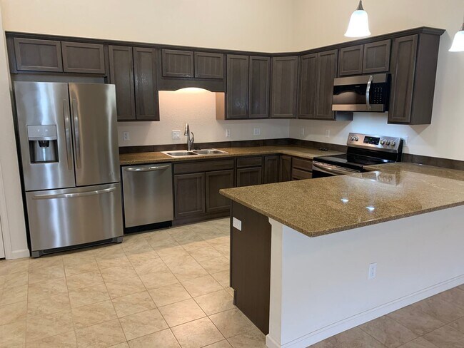 Building Photo - 2 BEDROOM, 2 BATHROOM TWINHOME WITH 2 CAR ...