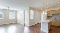 Located at 15101 Fairfield Ranch Rd in Chino Hills, CA, this well-appointed 3-bedroom, 2-bathroom residence offers a thoughtfully designed single-floor layout. The open-concept kitchen and living area serves as the heart of the home, showcasing a large center island with a quartz countertop, light wood cabinetry, a mosaic tile backsplash, stainless steel appliances including a gas range and French door refrigerator, and elegant pendant lighting. Wood-look flooring flows seamlessly throughout the entire residence, adding warmth and cohesion to every room. The spacious primary bedroom features dual windows that invite abundant natural light and includes access to a dedicated closet. All bedrooms are equipped with ceiling fans and blinds for comfort and privacy. The two full bathrooms are consistently finished with wood-toned vanities, quartz countertops, and tub-shower combinations with brushed nickel fixtures. A dedicated entrance, two closets, and a private balcony further enhance the functionality of the space. The clean, neutral color palette and modern finishes throughout create a bright, move-in-ready atmosphere suited to a variety of lifestyles.