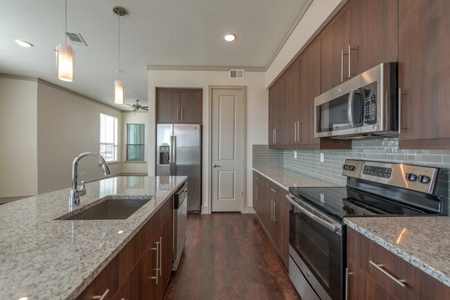 Building Photo - Experience the Art of Fine Apartment Living!