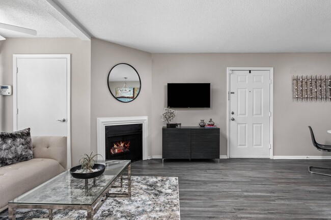 Living Room with Fireplace - Stonebridge Crossing Apartments