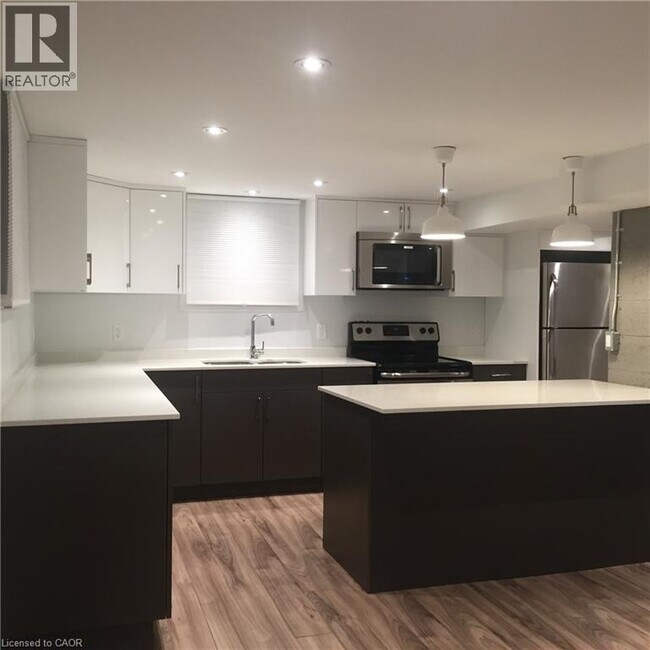 Photo du bâtiment - 122 Macassa Ave