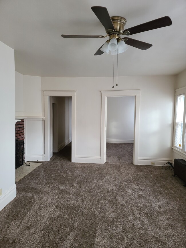Living room into hall and first bedroom - 19 Penn St