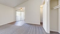 Located at 140 S Highland Ave in Placentia, California, this single-floor residence offers three bedrooms, two bathrooms, and a practical, well-organized layout. The living room features vaulted ceilings, neutral carpet, and a ceiling fan, with a sliding glass door that opens to a private balcony, allowing natural light to fill the space. Adjacent to the living room, the dining area flows seamlessly into the kitchen, which is equipped with white cabinetry, a built-in range, dishwasher, and a window that brings in additional natural light. Wood-look vinyl plank flooring runs throughout the kitchen and bathrooms, providing a clean and cohesive look. The two bathrooms are finished with white vanities featuring speckled countertops; one includes a shower-tub combo, while the other offers a standalone corner shower stall. Each bedroom is carpeted and features sliding closet doors with built-in shelving in select rooms, along with windows that provide natural light and views of the surrounding area. Textured ceilings are present throughout. The three dedicated closets add ample storage, completing this efficiently designed and well-appointed residence in the heart of Placentia.