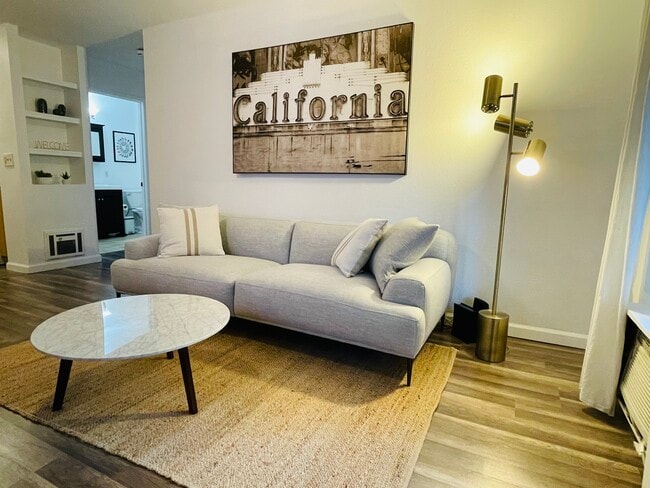 Living room with Roku tv for streaming wall ac in living room - 6386 Rancho Mission Rd