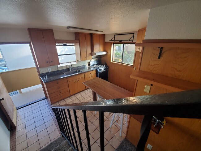 kitchen from interior stairway - 4870 Del Monte Ave