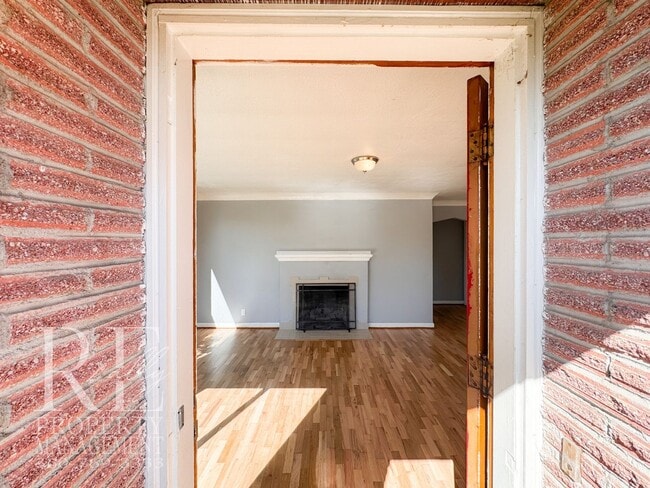 Building Photo - Timeless Charm Meets Comfort – 2-Bedroom Brick Home with Fireplace & Fenced Yard