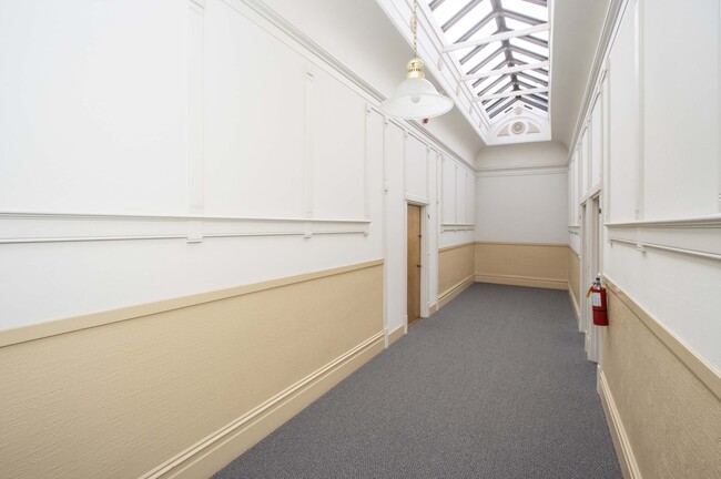 hallway with skylights - Polk / Jackson Apartments