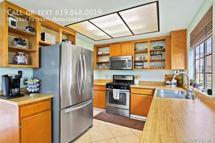 Primary Photo - Well maintained, single-level, end unit in...
