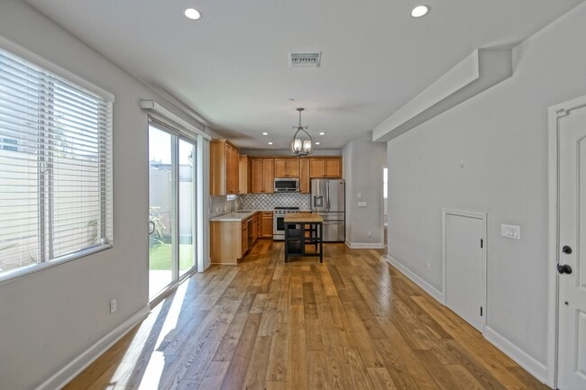 Building Photo - BUILT IN 2019: SPACIOUS & BRIGHT, DETACHED TOWNHOUSE W/ 2-CAR GARAGE & FENCED YARD IN GREAT RESID...