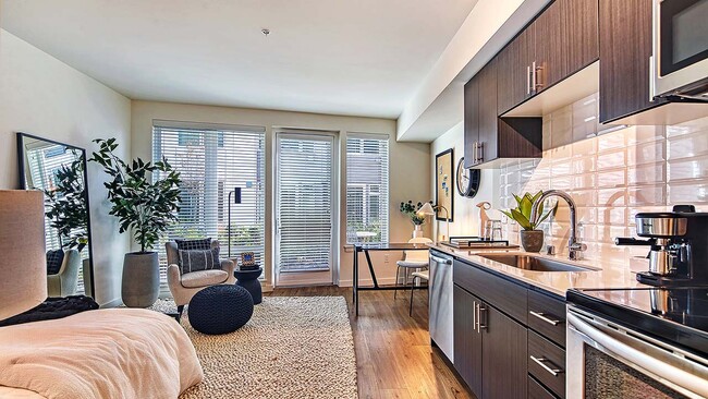 Griffis Shoreline apartment kitchen with quartz countertops. - Griffis Shoreline