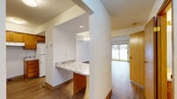 Located at 2830 Albemarle Dr in Reynoldsburg, Ohio, this three-bedroom, three-bathroom home spans three floors, offering a well-distributed and functional layout. The main living level features a spacious living room with wood-look flooring, a striking stone fireplace with a wooden mantel, and a sliding glass door that fills the space with natural light and provides access to the backyard. Adjacent to the living room, the kitchen is equipped with warm honey-toned wood cabinetry, marble-style laminate countertops, and a pass-through breakfast bar that connects seamlessly to the dining area. The main level also benefits from a convenient entry with a large sliding door that opens to outdoor views. The upper floors host all three bedrooms, each carpeted and ceiling fan-equipped for comfort. The generously sized primary bedroom includes a sliding-door closet and is complemented by natural window light. Three full bathrooms are distributed throughout the home, each featuring a tub-shower combination, single vanity, and wood-look flooring. The unfinished basement level offers a clean, open concrete-floored space with exposed joists overhead, providing excellent potential for storage or future finishing. A central staircase connects all three levels, making for an efficient and accessible floor plan throughout.