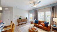 Located at 8263 NW Selvitz Rd in Port Saint Lucie, FL, this one-bedroom, one-bathroom residence offers a well-designed, single-story layout with a cohesive open-concept floor plan. Light wood-look flooring runs throughout, complementing the bright, neutral color palette that defines the space.

The living room is warm and inviting, featuring a ceiling fan with light fixture, a soft blue accent wall, and large windows that allow ample natural light to filter in. The space flows seamlessly into a dedicated dining area, which is tucked into a cozy nook accented by stylish wall art.

The kitchen is well-appointed with gray shaker-style cabinetry extending to the ceiling for generous storage, granite countertops, a white subway tile backsplash, stainless steel appliances, and a peninsula with a sink — ideal for both cooking and casual dining.

The bedroom is a comfortable retreat, offering two large windows with garden views, light wood floors, and ample room to furnish. A hallway connects the bedroom to the full bathroom, which features a granite-topped vanity with an undermount sink, gray cabinetry with gold hardware, a tub-shower combination, and wood-look tile flooring. This residence combines functional design with modern finishes in a convenient Port Saint Lucie location.