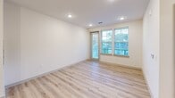 Located at 451 W Blount Ave in Knoxville, TN, this well-appointed 1-bedroom, 1-bathroom unit offers a thoughtfully designed single-floor layout. The open-concept kitchen and living area serves as the heart of the home, featuring crisp white shaker cabinets, dark countertops, a subway tile backsplash, and a center island with pendant lighting and a built-in sink. Stainless steel appliances—including a refrigerator, range, and microwave—complete the kitchen. Light hardwood-style flooring flows throughout the main living areas, complemented by recessed lighting and large windows that invite abundant natural light. The living area provides access to a private balcony through a glass-paneled door. The bedroom offers a comfortable retreat with plush carpet, a ceiling fan, and multiple windows with outdoor views. Two closets—fitted with wire shelving systems for organized storage—serve the bedroom. The bathroom features a dark-countertop vanity with white cabinetry, a large mirror with stylish light fixtures, and a tiled soaking tub. Additional conveniences include a dedicated laundry space and a utility room, rounding out this functional and modern Knoxville residence.