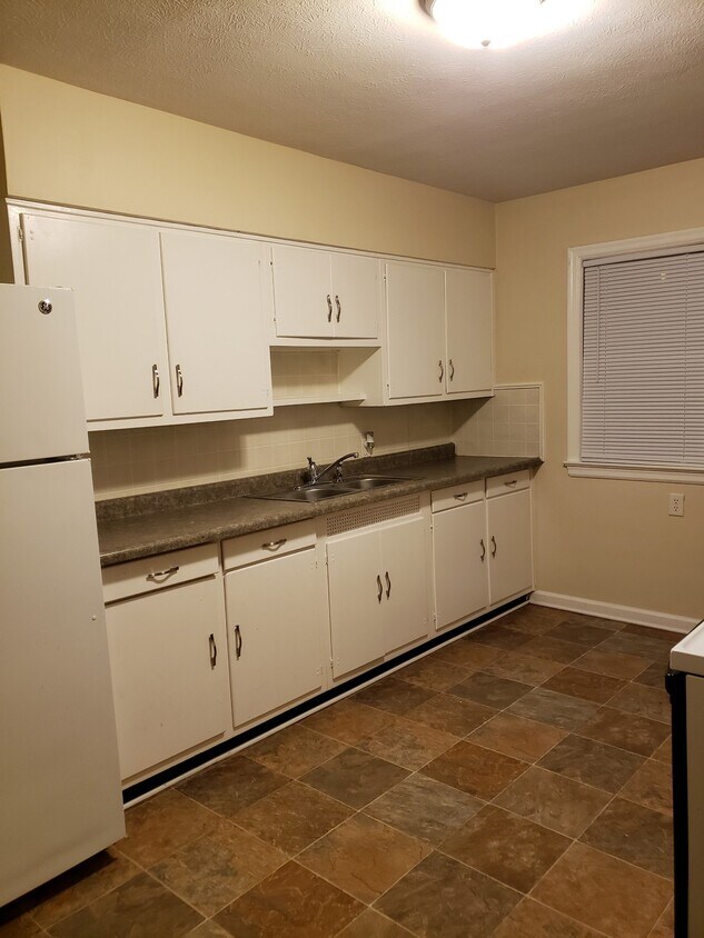 Large kitchen with refrigerator & range - 1130 N Michigan St