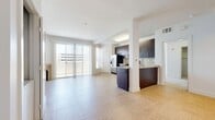 This contemporary 700 square foot apartment in Marina Del Rey offers a blend of comfort and style. The open-concept living area is anchored by a sleek fireplace, creating a focal point for relaxation and entertainment. The kitchen is a standout feature, boasting dark wood cabinetry, stainless steel appliances, and a granite countertop, perfect for culinary enthusiasts.

The primary bedroom, measuring 140 square feet, provides ample space and is complemented by plush carpeting and large windows that invite natural light. Both bathrooms feature modern fixtures, including a spacious vanity with a granite countertop and ample storage.

Throughout the apartment, you'll find a harmonious mix of materials - from the warm tile flooring in the living areas to the soft carpeting in the bedrooms. The unit also includes in-unit laundry facilities for added convenience.

Large windows throughout the apartment not only brighten the space but also offer views of the surrounding area. The neutral color palette provides a blank canvas for personal decoration, allowing residents to easily make the space their own.

Located at 13603 Marina Pointe Dr, this A318 unit combines the convenience of urban living with the tranquility of a marina setting, making it an ideal home for those seeking a modern, low-maintenance lifestyle in the heart of Marina Del Rey.