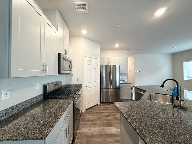 Building Photo - Modern 3-Bedroom townhome with Open Layout, Community Pool & Prime Location
