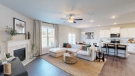 Located at 3940 Fence Rd NE in Auburn, GA, this well-appointed two-story home offers 3 bedrooms, 4 bathrooms, and a thoughtfully designed layout spread across two floors. The welcoming entrance opens into a bright, open-concept main level where the living room, dining area, and kitchen flow seamlessly together. The living room features hardwood-style flooring, a ceiling fan, and large windows that fill the space with natural light. The kitchen is a standout, boasting white shaker cabinetry, granite countertops, subway tile backsplash, stainless steel appliances, and a central island with a sink. A separate formal dining room with a chandelier and oversized window adds an elegant touch, while a dedicated office provides a quiet workspace. Upstairs, the generously sized primary bedroom includes a walk-in closet with built-in shelving. Two additional bedrooms offer comfortable accommodations, one with plush carpeting and natural light. A versatile loft adds flexible living space, and a conveniently located laundry room with natural light and storage shelving rounds out the upper level. With five closets, four full bathrooms with clean finishes, and rich hardwood-style flooring throughout, this home blends practicality with modern style.