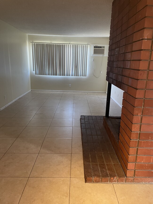 Living/Dining with fire place - 237 E Navilla Plz