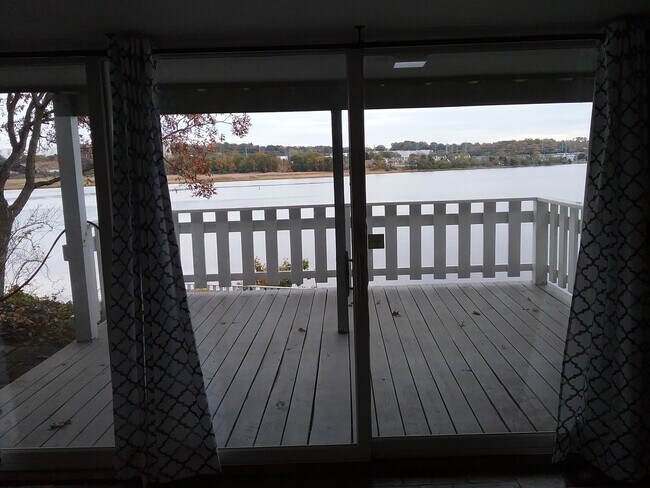Rear deck and water views - 100 River Rd