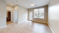 Located at 5636 Old Hickory Blvd in Nashville, TN, this one-bedroom, one-bathroom unit offers a thoughtfully designed single-level layout that maximizes every square foot. The open-concept kitchen and living area serves as the heart of the home, featuring light hardwood-style flooring, recessed lighting, and large windows that invite natural light and outdoor views. The kitchen is equipped with granite countertops, a peninsula island with pendant lighting and a built-in sink, medium-toned wood cabinetry, and black and stainless steel appliances including a refrigerator, range, and over-the-range microwave. The living area opens to an exterior door, providing access to an outdoor space with neighborhood views. The bedroom is carpeted and generously proportioned, with a large window offering additional natural light and views of the surrounding community. The full bathroom features warm wood cabinetry with granite countertops, a wide vanity mirror, light wood-look tile flooring, and a tiled soaking tub and shower combination. A dedicated laundry room with a full-size washer and dryer and overhead wire shelving adds practical convenience to the unit's well-rounded layout.