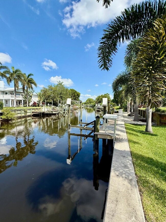 Building Photo - Palm City Home with Dock and Lift