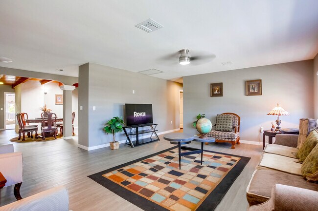 Enjoy open concept living w/ seamless transition from the living to the dining space - 4258 Feather Ave