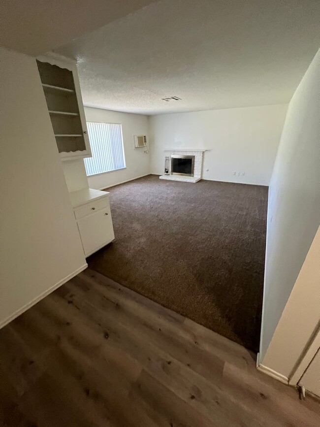 Building Photo - 4 bedroom 2 bath,  fenced yard w/ fruit tr...