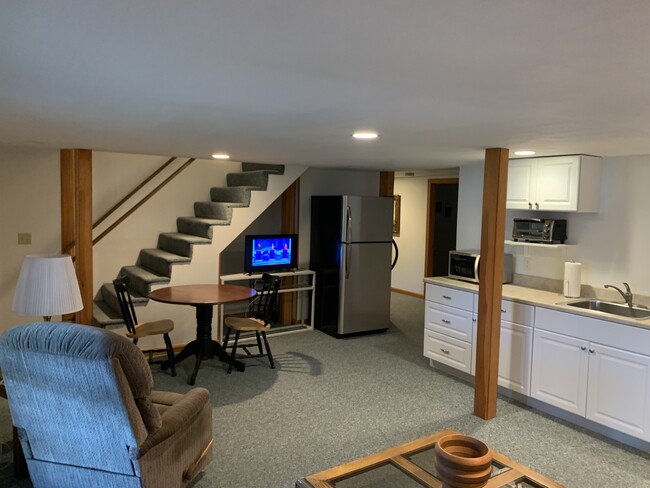 Kitchen, Living Room and Dining Area. Emergency Exit Stairs in PhotoLarger Bedroom # 1 - 264 Little Bay Rd