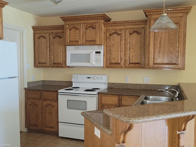 Foto del edificio - 2 br, 2.5 bath 4plex - 1402 W Kiwi Ave 2