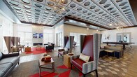 This contemporary community lounge is a thoughtfully designed single-floor gathering space that blends bold aesthetics with comfortable, functional areas. The centerpiece of the main lounge is a striking coffered ceiling adorned with a geometric hexagonal tile pattern, complemented by eye-catching pendant and chandelier lighting in mixed metallic finishes. Exposed wood beams add warmth and contrast to the industrial-modern design. Flooring transitions seamlessly between rich hardwood planks and patterned hexagonal tile, defining distinct zones within the open layout. Seating arrangements are varied and inviting, featuring dramatic high-back wingback chairs in burgundy and textured fabric, modular navy blue sectionals, leather sofas, and intimate bistro-style tables for two positioned alongside floor-to-ceiling windows with adjustable blinds that flood the space with natural light and offer outdoor views. A floor-to-ceiling stone fireplace wall anchors one lounge area, topped by a mounted flat-screen television. A billiards table adds a recreational focal point, while a sliding barn door detail adds rustic charm. The kitchenette bar area features dark cabinetry, granite countertops, open floating shelves against a bold blue accent wall, a coffee station, and a mosaic blue tile bar front with sleek bar stools. Abstract artwork is displayed throughout, adding a curated, gallery-like atmosphere to the space.