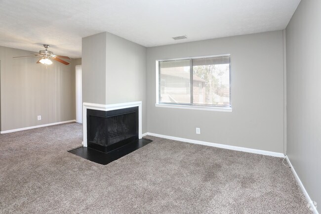 2BR, 1BA - 990 SF - Living Room with Fireplace - Patchen Place Apartments